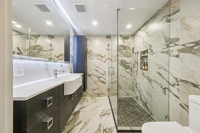 243 3rd St Unit 1, Jersey City, NJ 07302 - full bath with marble tiled floors, vanity, a marble finish shower, and recessed lighting