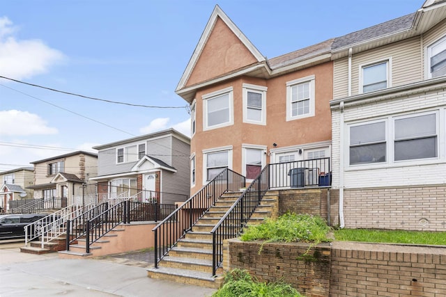 99 W 50th St, Bayonne, NJ 07002 - multi unit property with brick siding and stairway