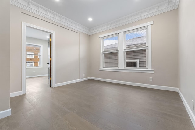 99 W 50th St, Bayonne, NJ 07002 - empty room with plenty of natural light, wood finished floors, baseboards, ornamental molding, and recessed lighting