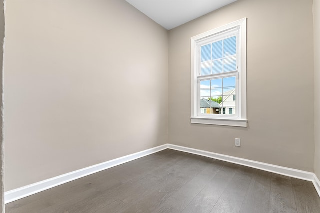 99 W 50th St, Bayonne, NJ 07002 - spare room featuring dark wood-style floors and baseboards