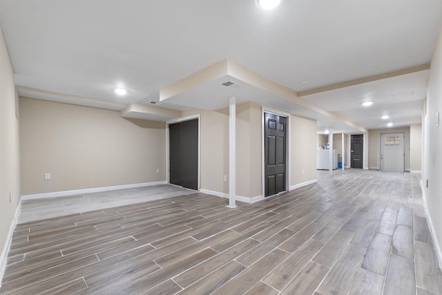 99 W 50th St, Bayonne, NJ 07002 - unfurnished living room with light wood-style flooring, baseboards, and recessed lighting