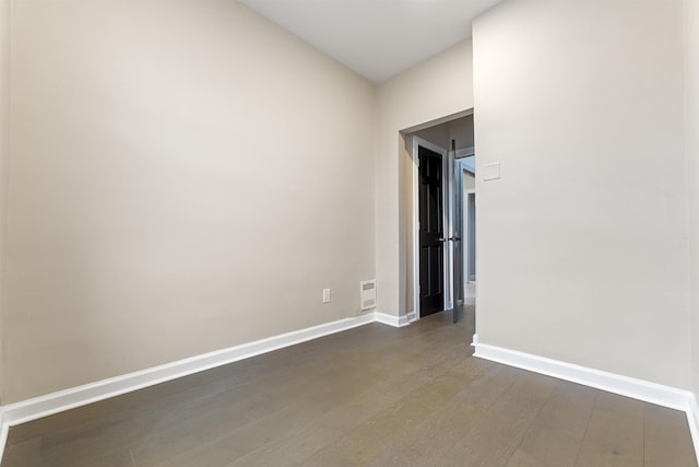 99 W 50th St, Bayonne, NJ 07002 - empty room with baseboards and dark wood-type flooring