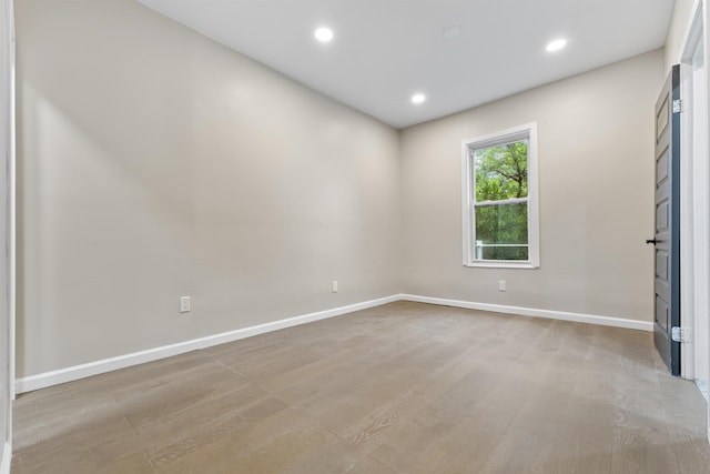 99 W 50th St, Bayonne, NJ 07002 - spare room with baseboards, recessed lighting, and light wood-type flooring