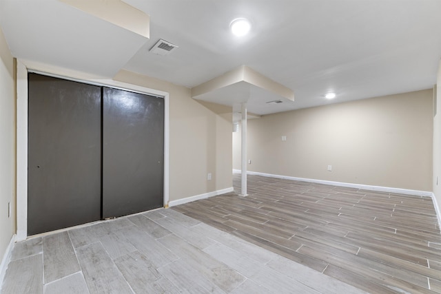 99 W 50th St, Bayonne, NJ 07002 - finished below grade area with light wood-style floors, baseboards, and recessed lighting
