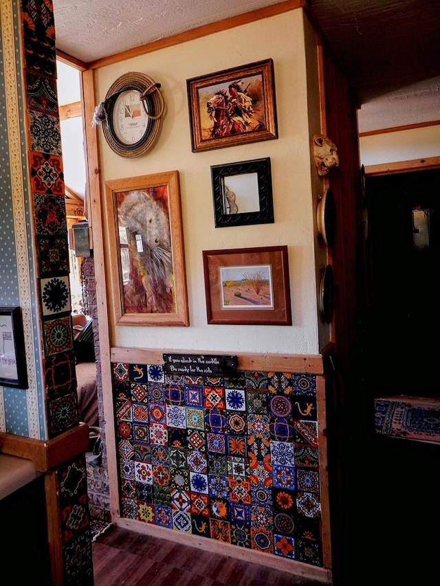 details featuring hardwood / wood-style flooring and a textured ceiling