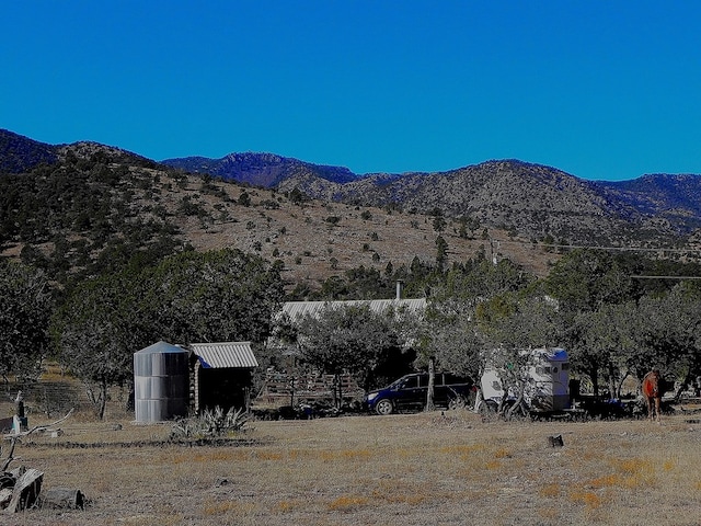 view of mountain feature with a rural view