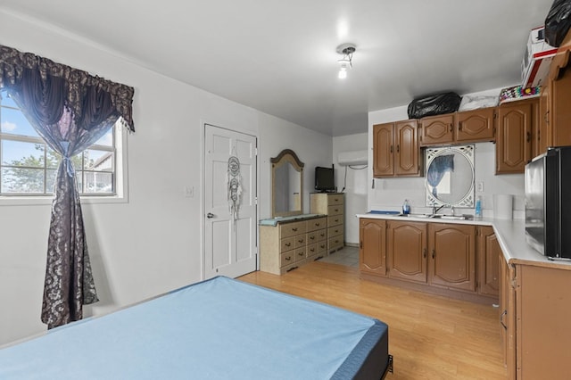 kitchen featuring light wood-type flooring, sink, and billiards