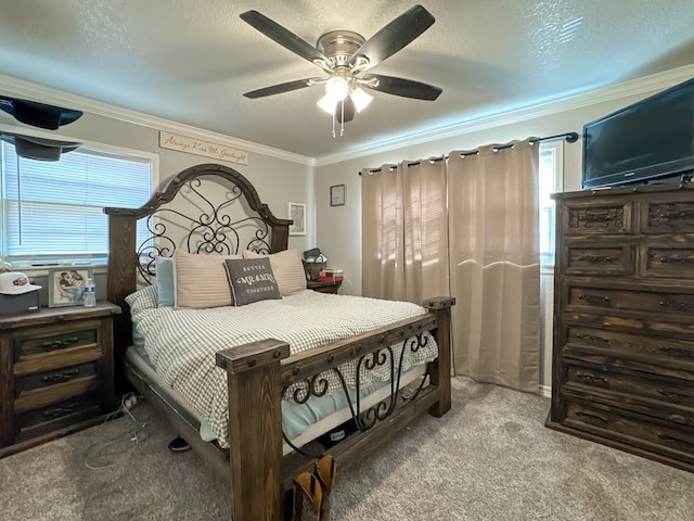 carpeted bedroom featuring ceiling fan, a textured ceiling, and crown molding