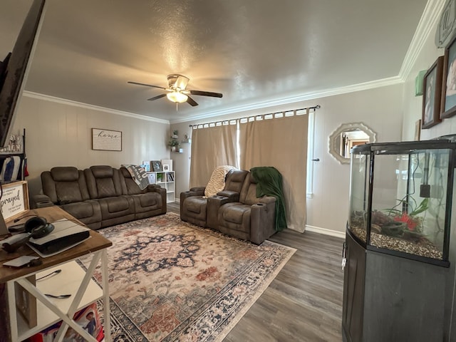 living room with ceiling fan, wood finished floors, and crown molding