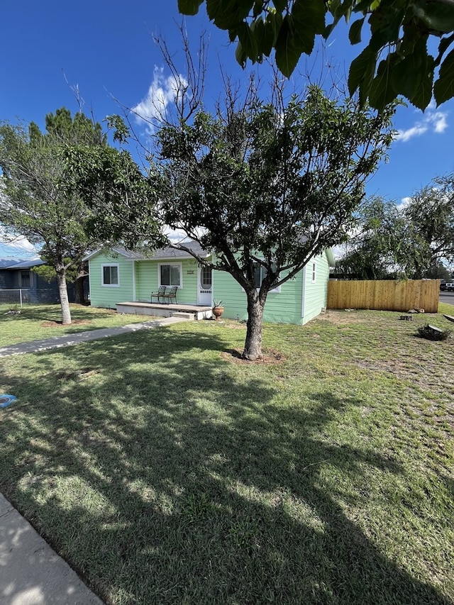 exterior space with a front lawn