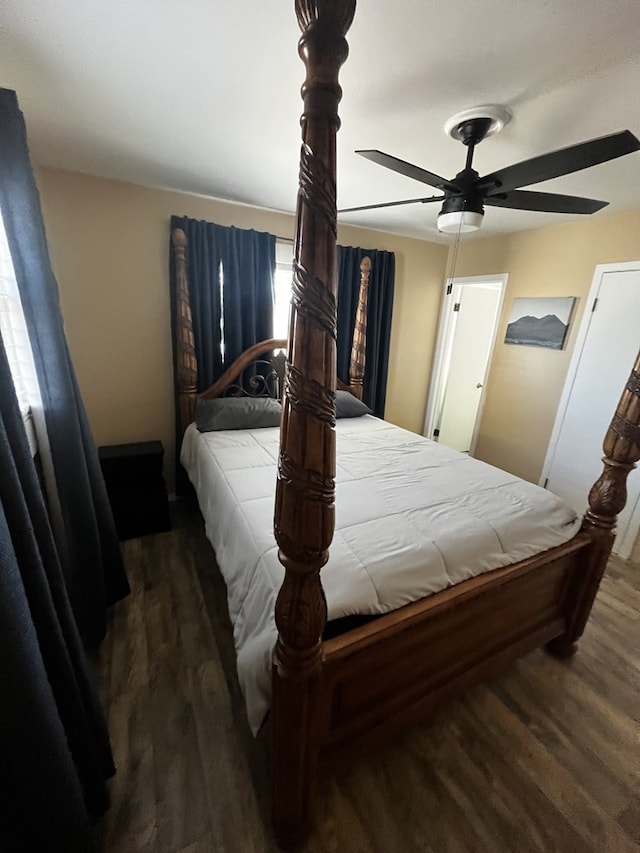 bedroom with ceiling fan and dark hardwood / wood-style floors