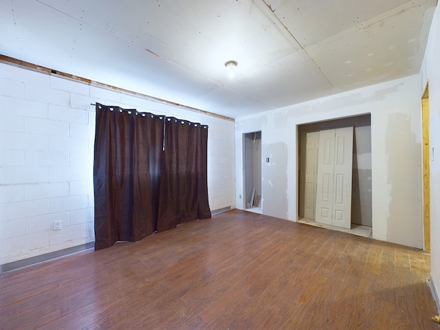 empty room with hardwood / wood-style floors