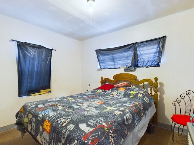 bedroom with wood-type flooring