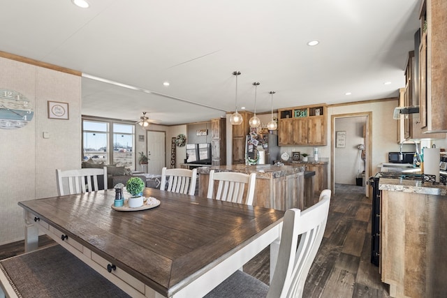 dining space featuring ceiling fan, dark wood-type flooring, ornamental molding, and recessed lighting