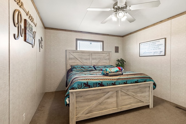 bedroom with a ceiling fan, visible vents, carpet flooring, and ornamental molding