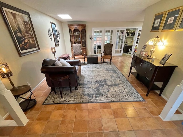 living room with light tile patterned floors and french doors