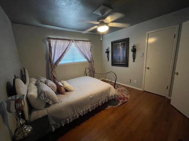 bedroom featuring hardwood / wood-style flooring and ceiling fan