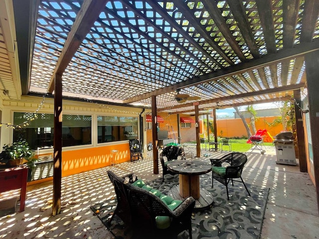 view of patio / terrace featuring area for grilling and a pergola