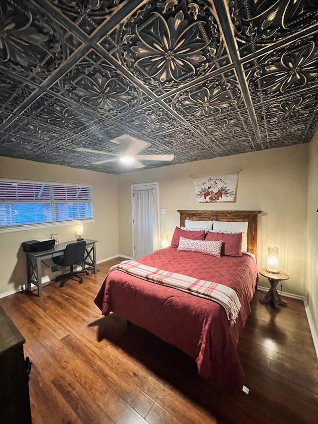 bedroom featuring hardwood / wood-style flooring and ceiling fan