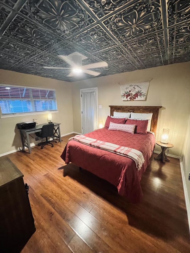 bedroom featuring ceiling fan and wood-type flooring