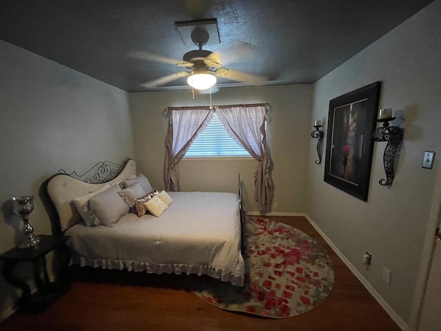 bedroom featuring ceiling fan and wood-type flooring