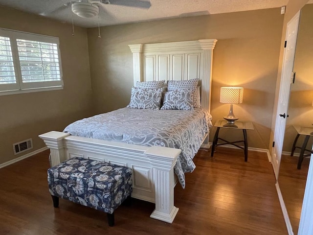 bedroom featuring ceiling fan and dark hardwood / wood-style flooring