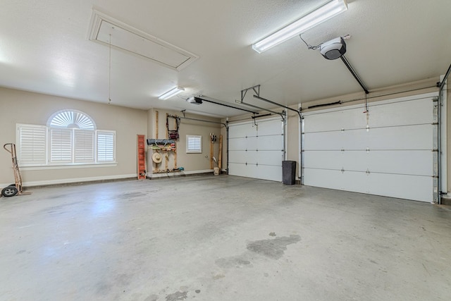 garage featuring a garage door opener