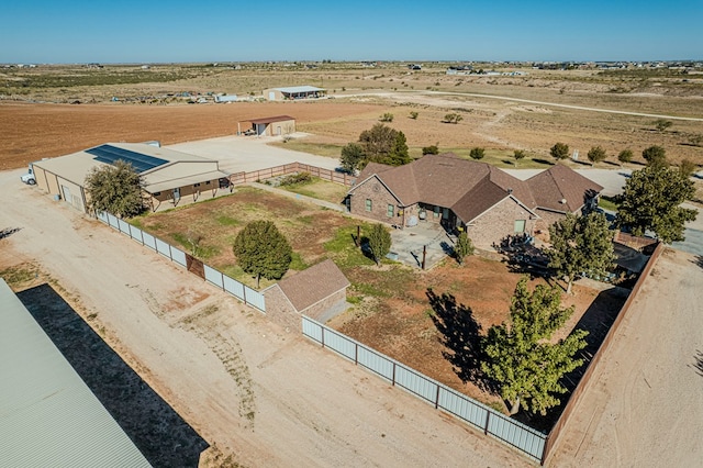 birds eye view of property with a rural view