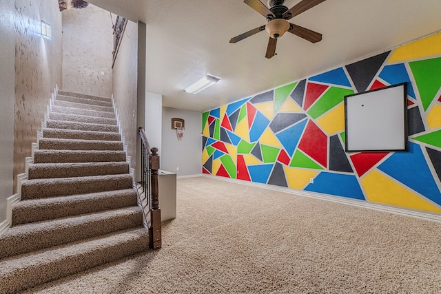 playroom featuring carpet and ceiling fan