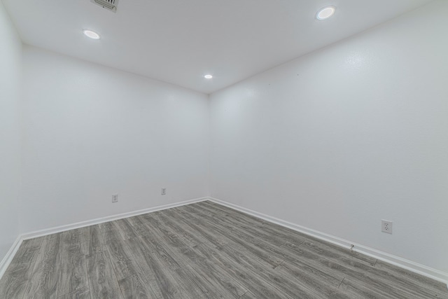 empty room with hardwood / wood-style floors