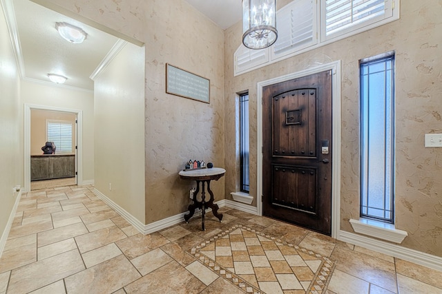 entryway featuring ornamental molding