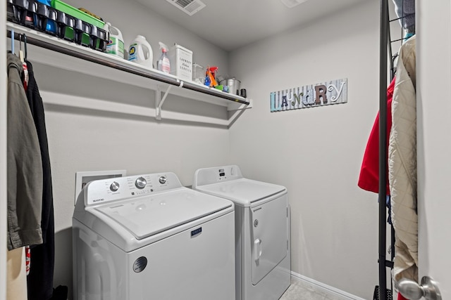 laundry room featuring independent washer and dryer