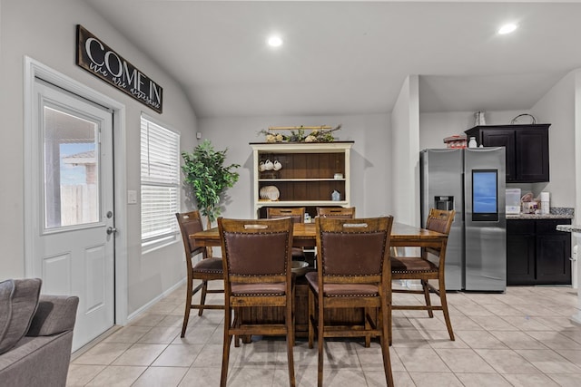 dining area with light tile patterned flooring