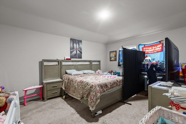 bedroom featuring light colored carpet