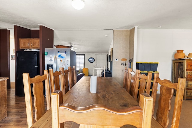 dining area featuring a ceiling fan and wood finished floors