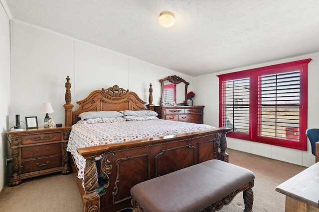 bedroom featuring light colored carpet and a textured ceiling