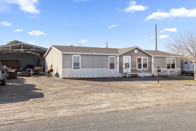 manufactured / mobile home featuring a carport