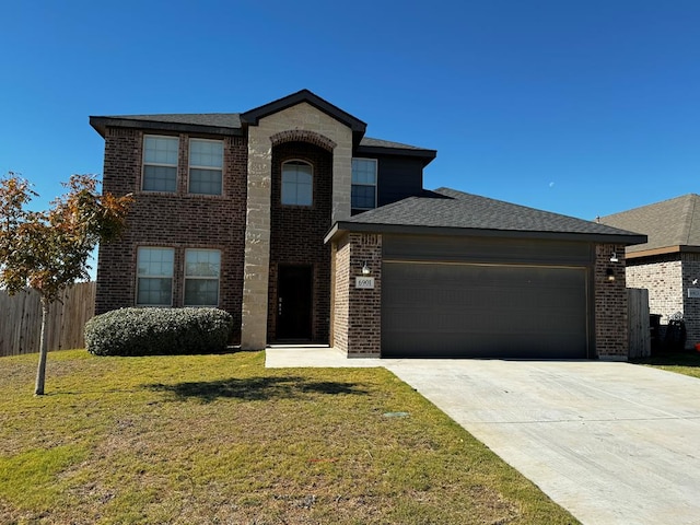 view of front facade featuring a front lawn and a garage