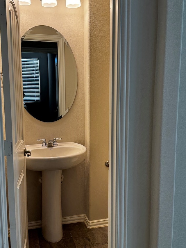 bathroom featuring hardwood / wood-style flooring and sink