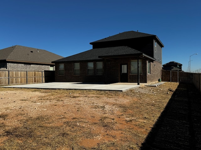 back of house with a patio area