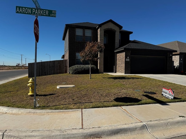 view of front of property with a garage