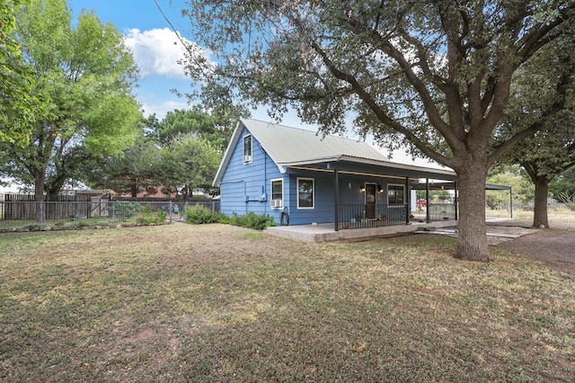 exterior space featuring a lawn and a porch