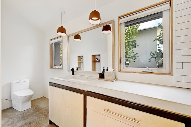 bathroom with vanity and toilet