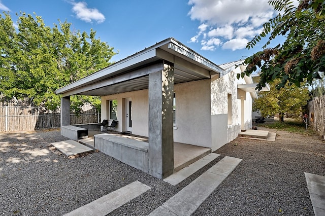 view of home's exterior with a patio