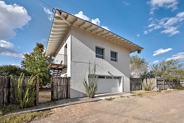 view of property exterior with a garage