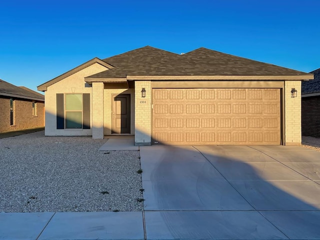 ranch-style house featuring a garage