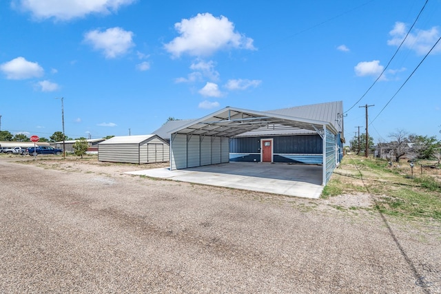 garage featuring a carport