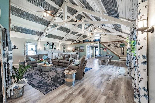 living room featuring ceiling fan, high vaulted ceiling, billiards, beamed ceiling, and hardwood / wood-style floors