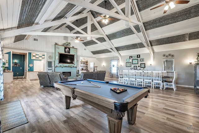 game room featuring hardwood / wood-style flooring, beamed ceiling, high vaulted ceiling, and billiards