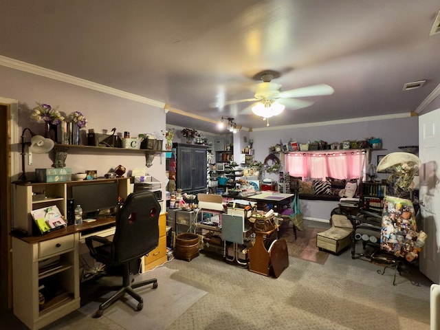 carpeted office featuring ceiling fan, visible vents, and ornamental molding